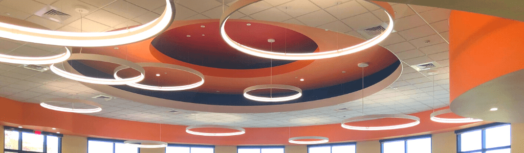 Photograph of Circular light fixtures showing the ceiling of the interior of the East Forest Park Branch