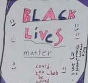 Quilt square that reads "Black Lives Matter" in blue and pink, surrounded by smiling faces.